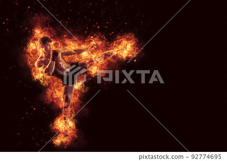 Fighter man punching in fire. MMA fighter 92774695