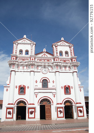 Historical Our Lady of Carmen church built in 1865 in the beautiful small town of Guatape in the region of Antioquia in Colombia 92776155