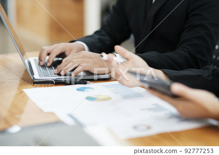 Businessmen teamwork meeting to discuss the investment. Businessmen teamwork meeting to discuss the investment. 92777253