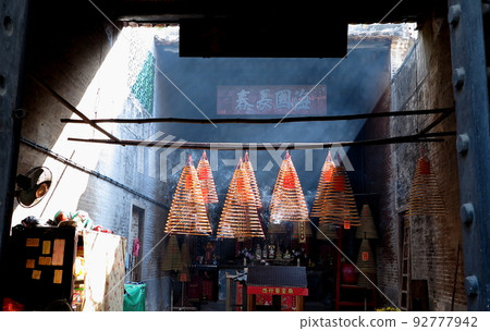 Spirals of incense sticks smoking, mausoleum in Macau Spirals of incense sticks smoking, mausoleum in Macau 92777942