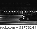 A late-night taxi running under an overpass 92778249