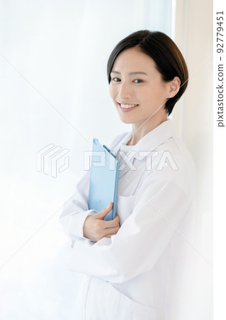A woman in a white coat A woman in a white coat 92779451
