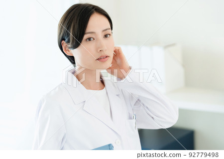 A woman in a white coat A woman in a white coat 92779498