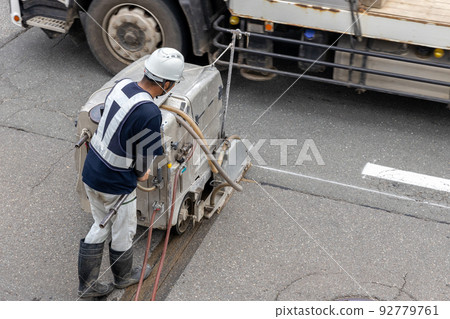 Cutting road asphalt 92779761