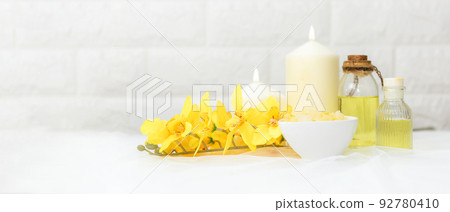 Soft and select focus. Thai Spa.  Hot stones setting for massage treatment and relax with yellow orchid  92780410