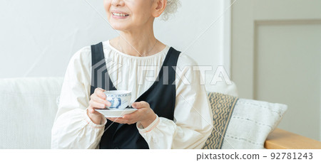 Senior woman drinking tea and relaxing Senior woman drinking tea and relaxing 92781243