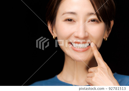 Photo of a woman doing a dental check Photo of a woman doing a dental check 92781513