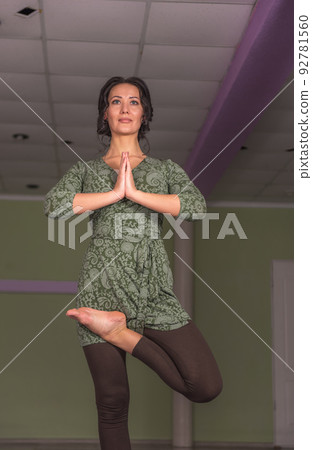 Girl doing yoga in fitness class Girl doing yoga in fitness class 92781560