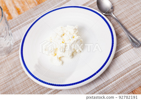 Delicious fresh young cheese on plate Delicious fresh young cheese on plate 92782191