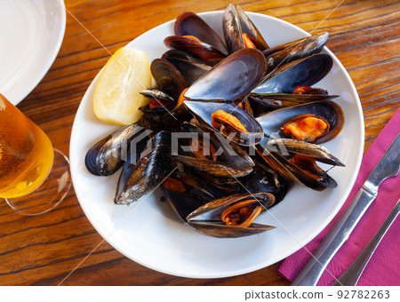 Steamed mussels served on table Steamed mussels served on table 92782263