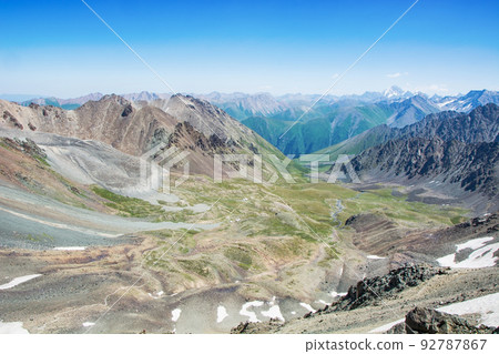 Idyllic summer landscape in the mountains with beautiful mountain trails and mountain tops. Idyllic summer landscape in the mountains with beautiful mountain trails and mountain tops. 92787867
