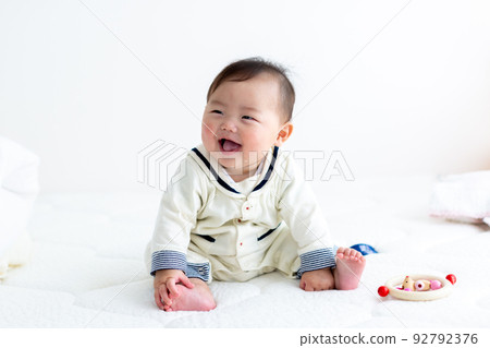 Baby sitting baby 92792376