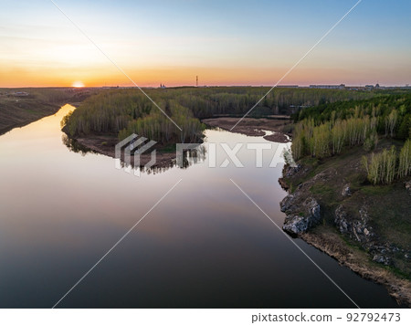 Confluence of the Iset and Kamenka rivers in the city Kamensk-Uralskiy. Iset and Kamenka rivers, Kamensk-Uralskiy, Sverdlovsk region, Ural mountains, Russia. Aerial view 92792473