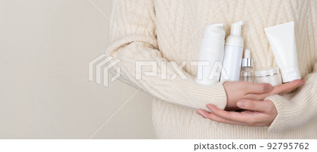 Skincare daily routine for healthy skin. Woman hands holding skincare product set included facial foam, cleanser, serum, moisturizer cream and body lotion packaging. Beauty and cosmetic concept. Skincare daily routine for healthy skin. Woman hands holding skincare product set included facial foam, cleanser, serum, moisturizer cream and body lotion packaging. Beauty and cosmetic concept. 92795762