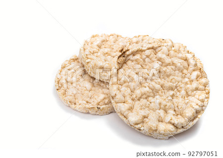 Exquisite round rice crackers on a white surface. Copy Space. Healthy eating. Exquisite round rice crackers on a white surface. Copy Space. Healthy eating. 92797051