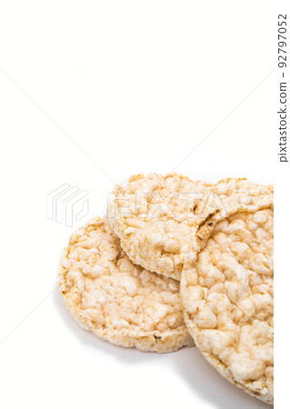 Exquisite round rice crackers on a white surface. Copy Space. Healthy eating. Exquisite round rice crackers on a white surface. Copy Space. Healthy eating. 92797052