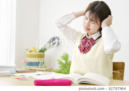 High school girl worried at home 92797964