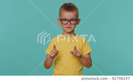 Displeased toddler children boy shakes finger and saying no, be careful, scolding and avoid danger Displeased toddler children boy shakes finger and saying no, be careful, scolding and avoid danger 92798247