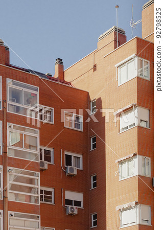 orange and white old house in madrid with strong lights and shadows orange and white old house in madrid with strong lights and shadows 92798525