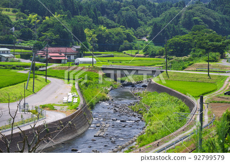 Kuwaki village landscape with Ayusawa River flowing through; original summer scenery Kuwaki village landscape with Ayusawa River flowing through; original summer scenery 92799579