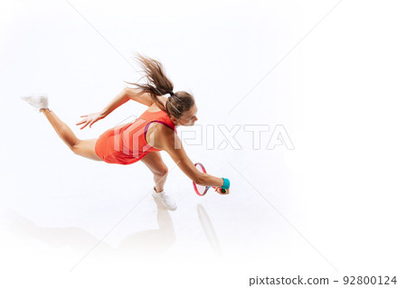 Top view portrait of woman, professional tennis player in motion with racket, training isolated over white studio background 92800124