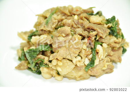 spicy stir fried chop beef with chili and basil leaf on plate spicy stir fried chop beef with chili and basil leaf on plate 92801022