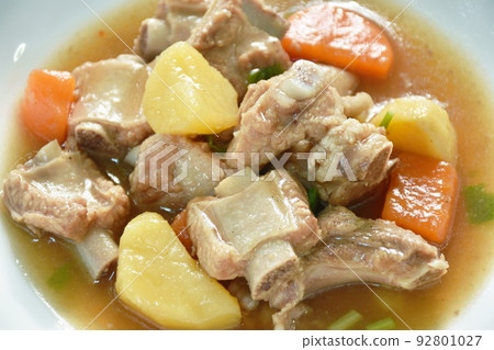boiled pork bone with potato and carrot stew on plate boiled pork bone with potato and carrot stew on plate 92801027