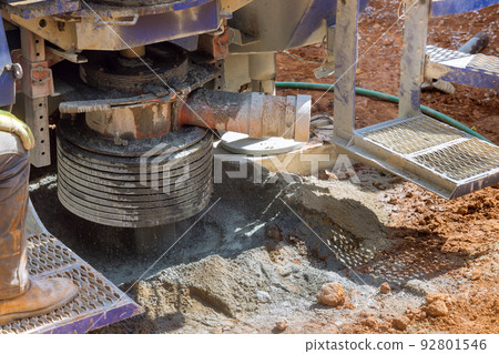 There is a portable hydraulic water well drilling rig on a private of land that is used to extract water 92801546