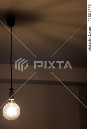 Lights and shadows of a bare light bulb lighting fixture Lights and shadows of a bare light bulb lighting fixture 92801766