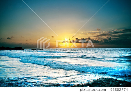 sunset of yellow tones on the seashore 92802774