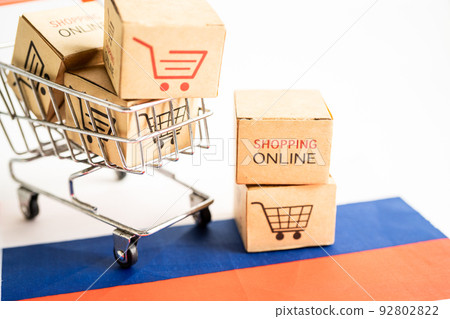 Box with shopping online cart logo and Russia flag, Import Export Shopping online or commerce finance delivery service store product shipping, trade, supplier concept. Box with shopping online cart logo and Russia flag, Import Export Shopping online or commerce finance delivery service store product shipping, trade, supplier concept. 92802822