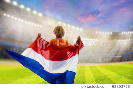 Netherlands football team supporter on stadium. Netherlands football team supporter on stadium. 92803758