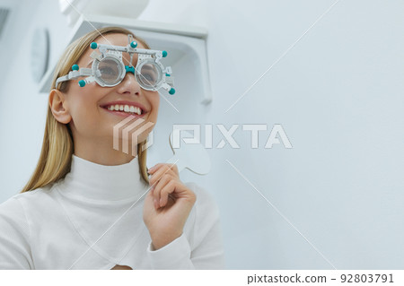 Eye Exam. Woman In Glasses Checking Eyesight At Clinic Eye Exam. Woman In Glasses Checking Eyesight At Clinic 92803791