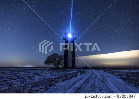 Bright lighthouse beaconing at the end of the milky way. Beautiful lighthouse. Bright lighthouse beaconing at the end of the milky way. Beautiful lighthouse. 92803847