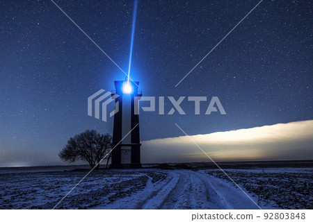 Bright lighthouse beaconing at the end of the milky way. Beautiful lighthouse. Bright lighthouse beaconing at the end of the milky way. Beautiful lighthouse. 92803848