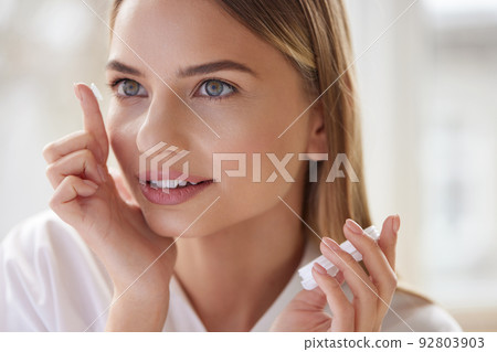 Eye care. Smiling Woman With Contact Eye Lens on Finger Closeup Eye care. Smiling Woman With Contact Eye Lens on Finger Closeup 92803903