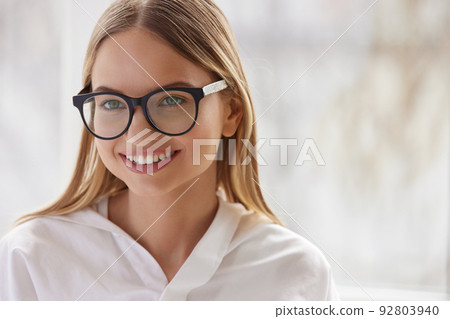 Female Eyeglasses. Portrait Of Young Woman Wearing Fashion Eyewear Female Eyeglasses. Portrait Of Young Woman Wearing Fashion Eyewear 92803940