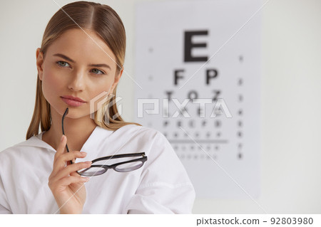 Visual Health. Female With Beautiful Face At Ophthalmologist Office Visual Health. Female With Beautiful Face At Ophthalmologist Office 92803980