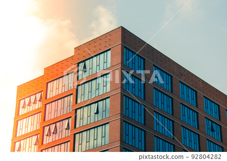 Exterior of modern architecture. Black windows, the facade of a modern office building, a shopping center in a megapole. Exterior of modern architecture. Black windows, the facade of a modern office building, a shopping center in a megapole. 92804282