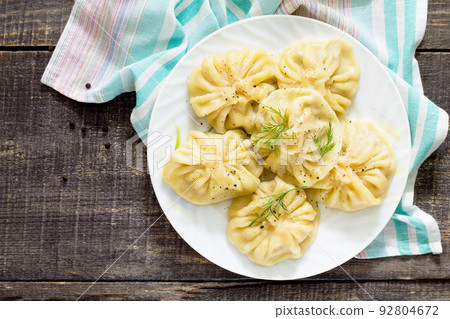 Traditional Georgian khinkali, selective focus, top view. Traditional Georgian khinkali, selective focus, top view. 92804672