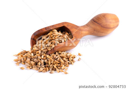 Utsho suneli seeds in wooden scoop, isolated on white background. Trigonella caerulea or blue fenugreek. Top view. Utsho suneli seeds in wooden scoop, isolated on white background. Trigonella caerulea or blue fenugreek. Top view. 92804733