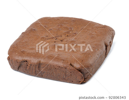 Whole square piece of chocolate cake isolated on white background 92806343