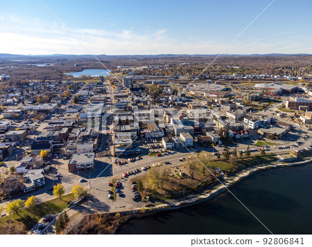 Aerial panoramic view of Rouyn-Noranda City and Osisko Lake on sunset time. Abitibi-Temiscamingue, Quebec, Canada. Aerial panoramic view of Rouyn-Noranda City and Osisko Lake on sunset time. Abitibi-Temiscamingue, Quebec, Canada. 92806841