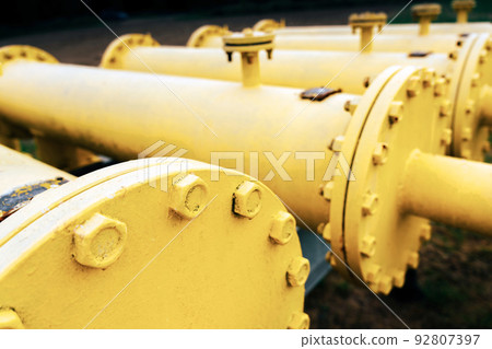 Gas transportation industry. Yellow gas pipeline power technology. Fuel pipe energy equipment. Gas pumping station, industrial zone. 92807397