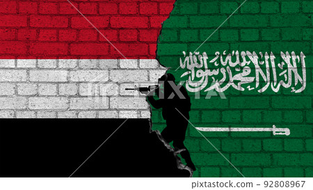 Saudi Arabia vs Yemen. Flags of countries on brick wall with the silhouettes of a military 92808967