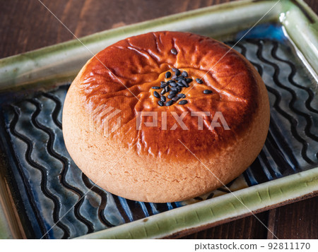 Tsukisamu Anpan is one of Hokkaido's famous sweets. Manju with red bean paste inside. Tsukisamu Anpan is one of Hokkaido's famous sweets. Manju with red bean paste inside. 92811170