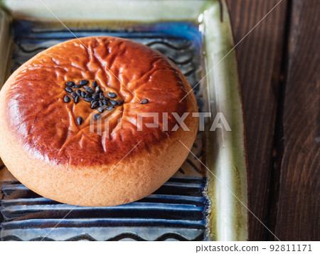 Tsukisamu Anpan is one of Hokkaido's famous sweets. Manju with red bean paste inside. Tsukisamu Anpan is one of Hokkaido's famous sweets. Manju with red bean paste inside. 92811171