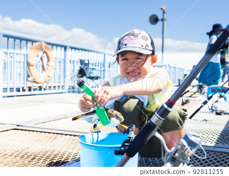 Girl enjoying fishing 92811255