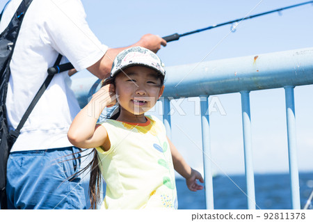 Girl enjoying fishing 92811378