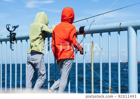 Children enjoying fishing Children enjoying fishing 92811491